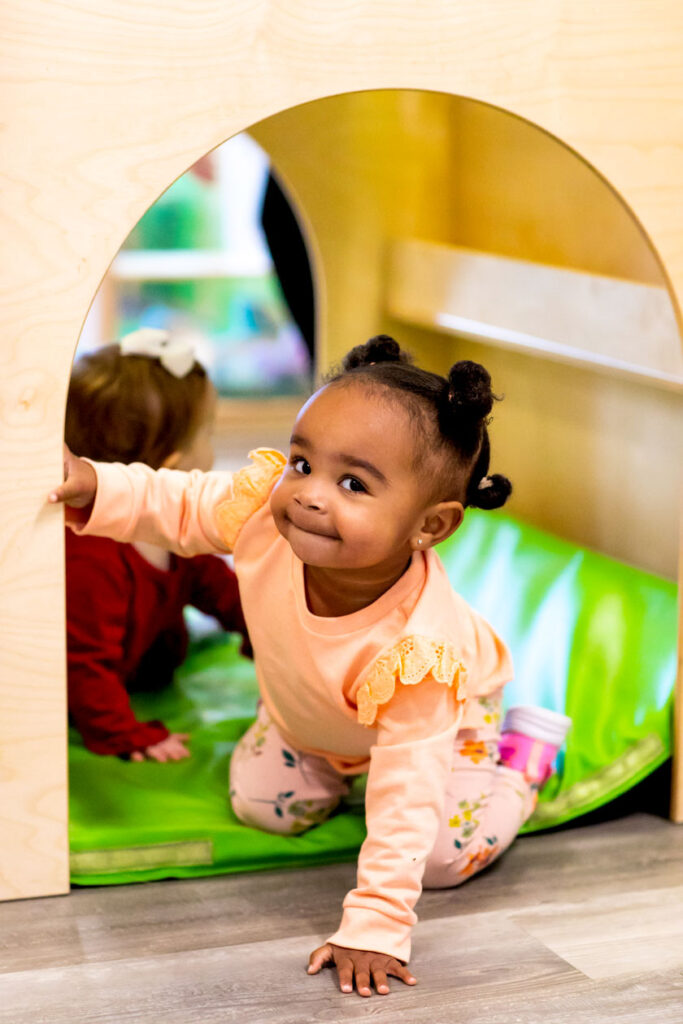 Two toddlers playing with each other